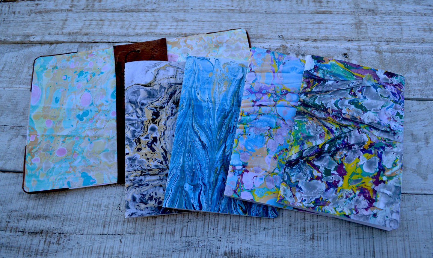 4 Hand-marbled notebooks with distressed leather bound