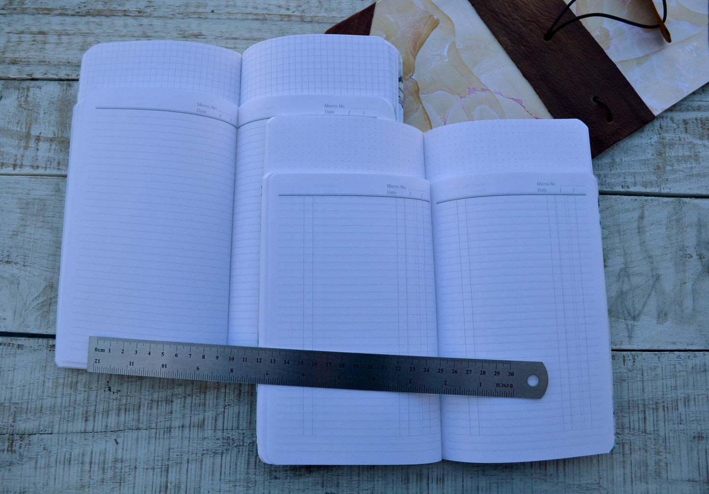 4 Hand-marbled notebooks with distressed leather bound