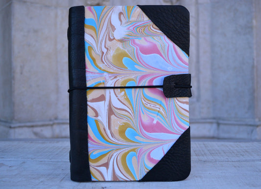 4 marbled notebooks inside and leather bound journal